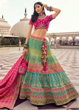 Load image into Gallery viewer, Green &amp; Pink Banarasi Silk Lehenga Choli with Heavy Embroidered work