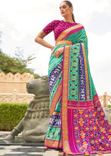 Load image into Gallery viewer, Blue &amp; Pink Patola Silk Saree with Zari Border &amp; Tassels On Pallu