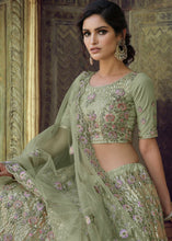 Laden Sie das Bild in den Galerie-Viewer, Olive Green Soft Net Lehenga Choli with Sequins, Thread, Zari &amp; Dori work