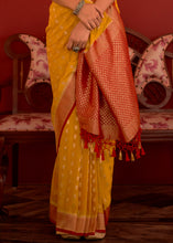 Load image into Gallery viewer, Saffron Yellow Zari Woven Georgette Saree with Contrast Border &amp; Blouse