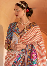 Load image into Gallery viewer, Shades Of Brown Printed Patola Silk Saree with Zari Border &amp; Tassels on Pallu
