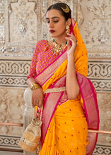 Load image into Gallery viewer, Saffron Yellow Patola Printed Soft Cotton Silk Saree with Zari Border