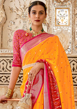 Load image into Gallery viewer, Saffron Yellow Patola Printed Soft Cotton Silk Saree with Zari Border