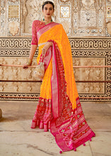 Load image into Gallery viewer, Saffron Yellow Patola Printed Soft Cotton Silk Saree with Zari Border