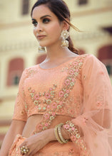 Laden Sie das Bild in den Galerie-Viewer, Salmon Orange Soft Net Lehenga Choli with Sequins, Thread, Zari &amp; Dori work