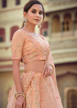 Laden Sie das Bild in den Galerie-Viewer, Salmon Orange Soft Net Lehenga Choli with Sequins, Thread, Zari &amp; Dori work