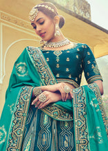 Laden Sie das Bild in den Galerie-Viewer, Shades Of Blue Banarasi Silk Lehenga Choli with Khatli and Heavy Embroidered work