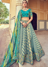 Laden Sie das Bild in den Galerie-Viewer, Blue &amp; Green Banarasi Silk Lehenga Choli with Khatli and Heavy Embroidered work