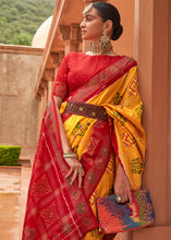 Load image into Gallery viewer, Saffron Yellow Printed Patola Silk Saree with Swaroski Work