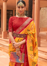 Load image into Gallery viewer, Saffron Yellow Printed Patola Silk Saree with Swaroski Work