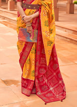 Load image into Gallery viewer, Saffron Yellow Printed Patola Silk Saree with Swaroski Work