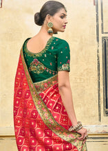 Load image into Gallery viewer, Shades Of Red Woven Patola Printed Dola Silk Saree with Heavy Embroidered Blouse