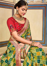 Load image into Gallery viewer, Shades Of Green Woven Patola Printed Dola Silk Saree with Heavy Embroidered Blouse