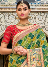 Load image into Gallery viewer, Shades Of Green Woven Patola Printed Dola Silk Saree with Heavy Embroidered Blouse