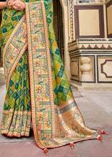 Load image into Gallery viewer, Shades Of Green Woven Patola Printed Dola Silk Saree with Heavy Embroidered Blouse