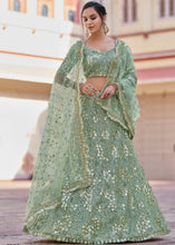 Laden Sie das Bild in den Galerie-Viewer, Frog Green Soft Net Lehenga Choli with Sequins, Thread &amp; Stone work