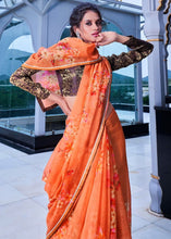 Load image into Gallery viewer, Amber Orange Floral Handprinted Organza Silk Saree