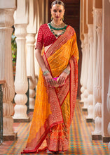 Cargar imagen en el visor de la galería, Saffron Yellow Leheriya Printed Georgette Saree with Gota Patti work