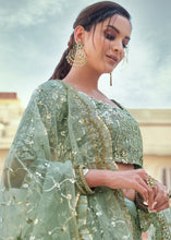 Laden Sie das Bild in den Galerie-Viewer, Frog Green Soft Net Lehenga Choli with Sequins, Thread &amp; Stone work