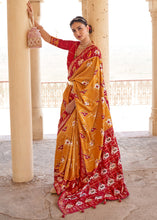Load image into Gallery viewer, Honey Orange Printed Patola Silk Saree with Zari Border &amp; Tassels on Pallu
